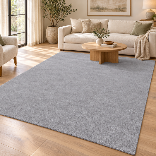 Light Grey Totally Plain Hand Tufted Rug | Borderless Solid Color styled in a decorated living room with sofa