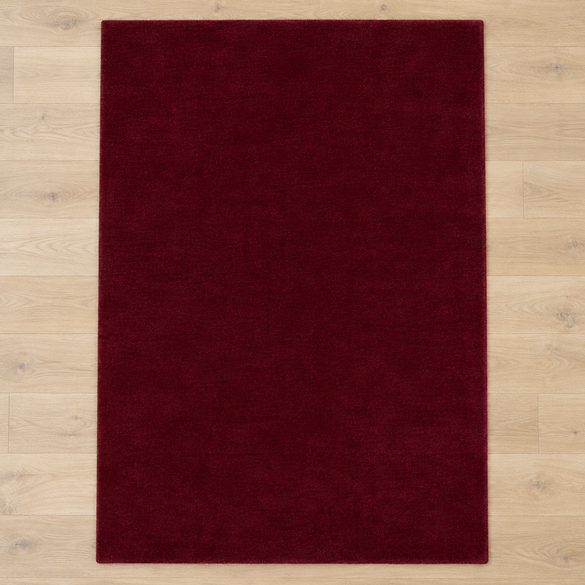Totally plain burgundy hand tufted rug, no border