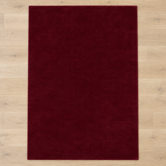 Totally plain burgundy hand tufted rug, no border