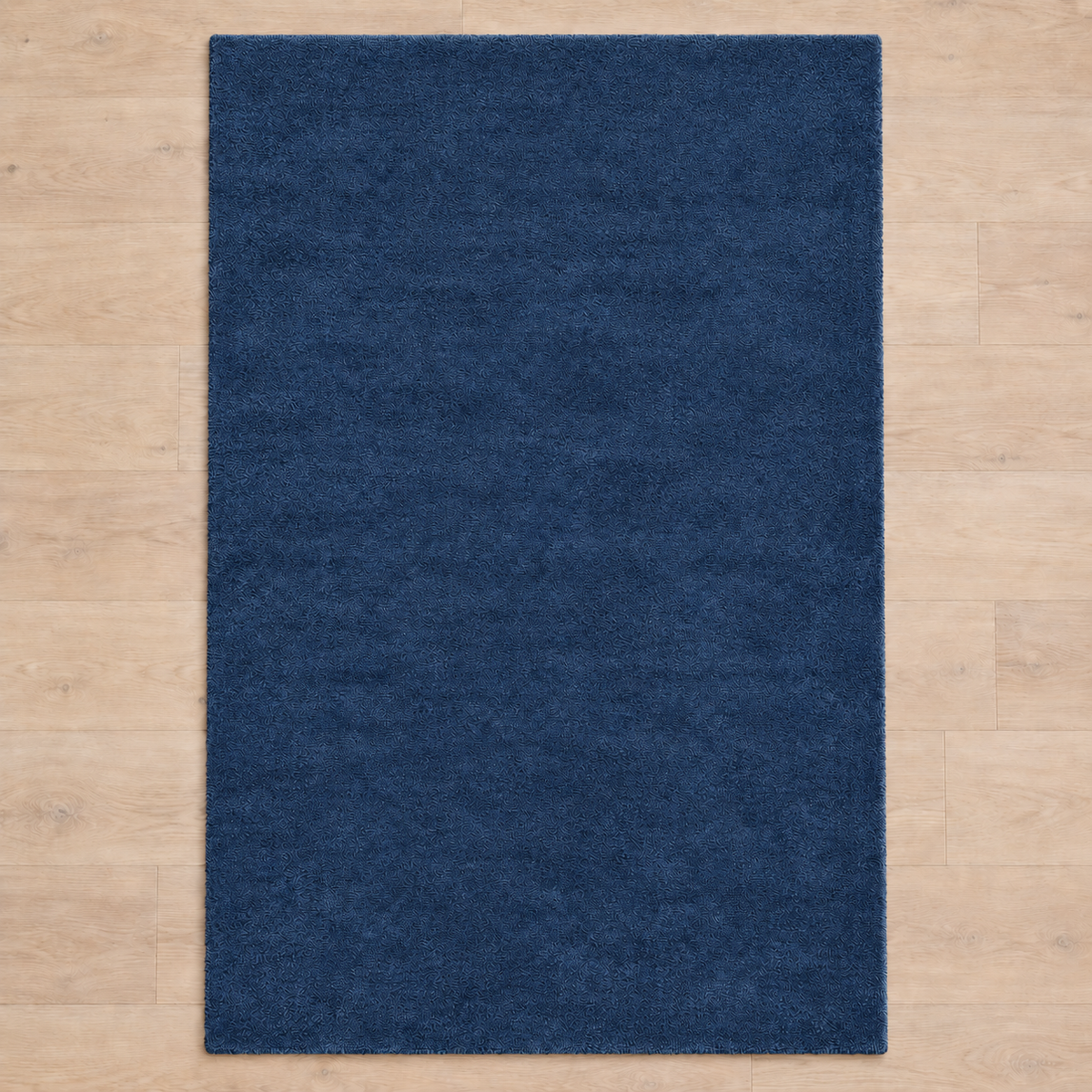 Totally plain deep blue hand tufted rug, no border