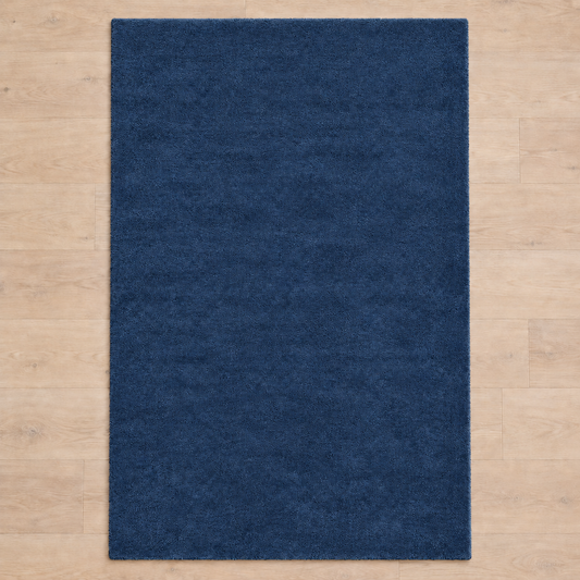 Totally plain deep blue hand tufted rug, no border