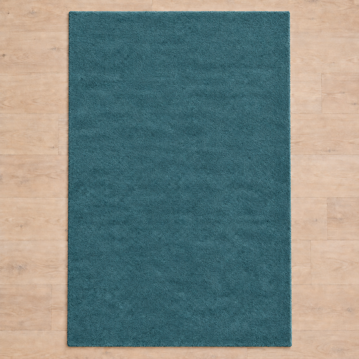 Totally plain muted teal hand tufted rug, no border
