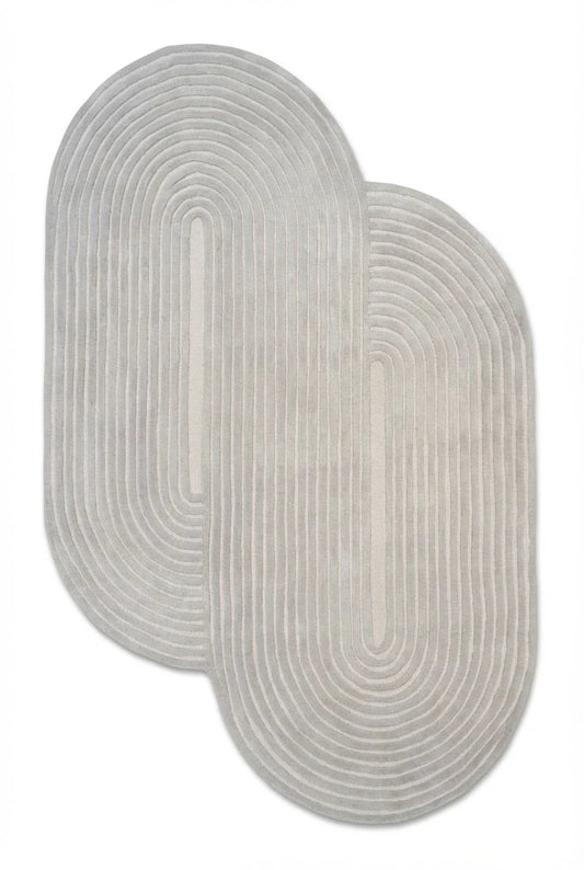 Greige sculpted double arch wool rug on white background