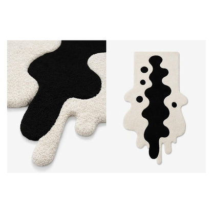 Black and ivory ink blot rug detail with front view