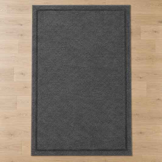 Charcoal Grey plain hand tufted single border rug