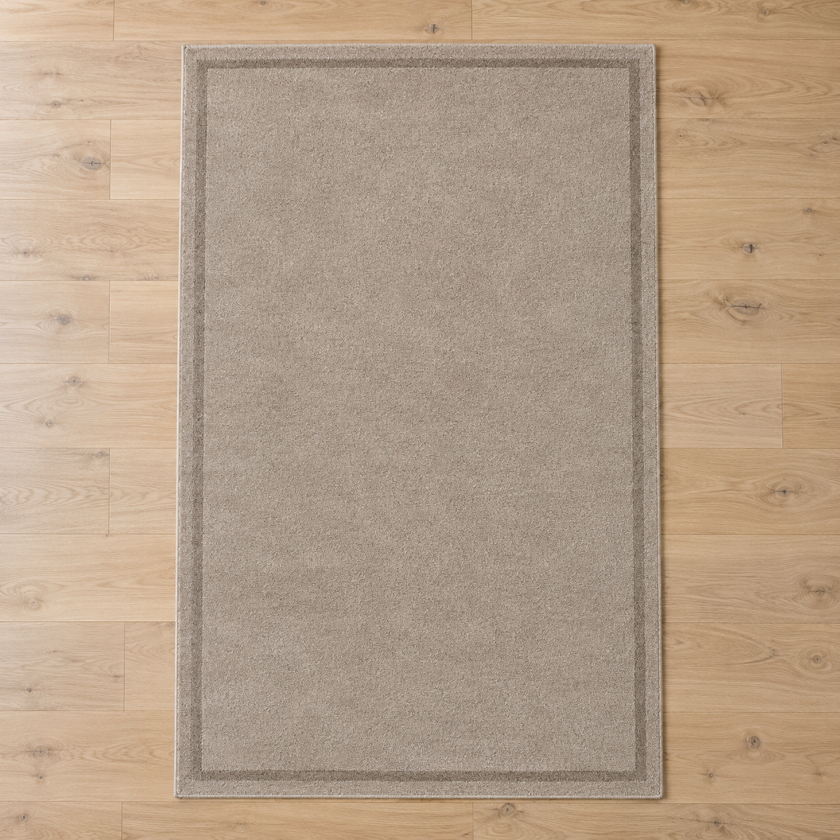 Greige plain hand tufted single border rug