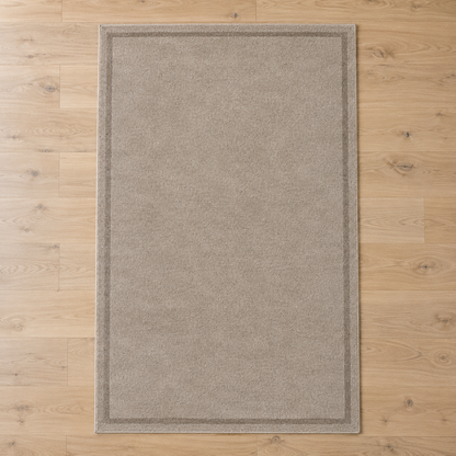 Greige plain hand tufted single border rug