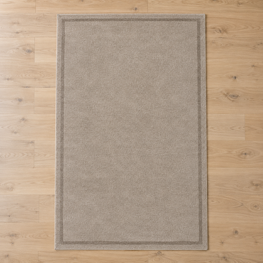 Greige plain hand tufted single border rug