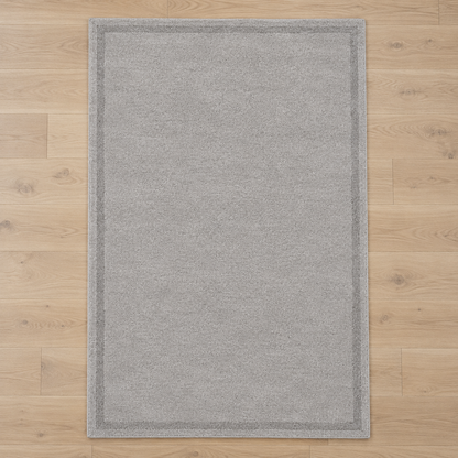 Light Grey plain hand tufted single border rug