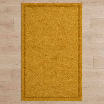 Mustard plain hand tufted single border rug