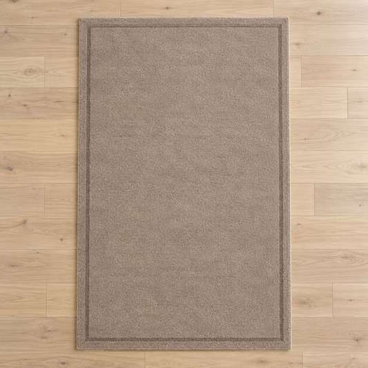 Taupe plain hand tufted single border rug