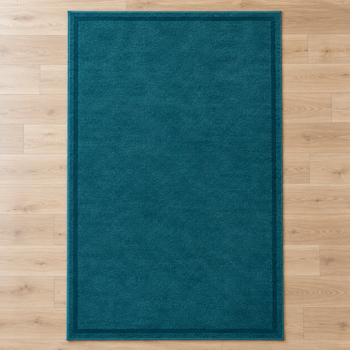 Teal plain hand tufted single border rug