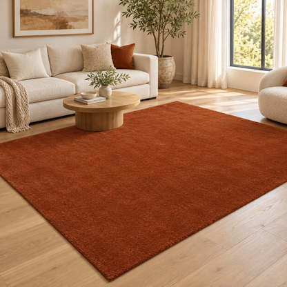 Rust Brown Totally Plain Hand Tufted Rug | Borderless Solid Color styled in a decorated living room with sofa